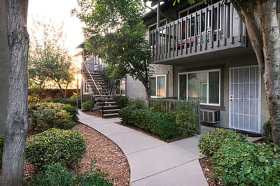 Pathway leading to residential building with greenery