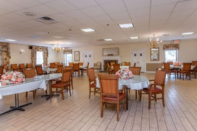 Dining area with tables set for residents.