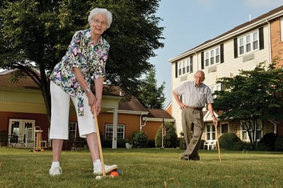 Residents enjoying croquet in the outdoor space