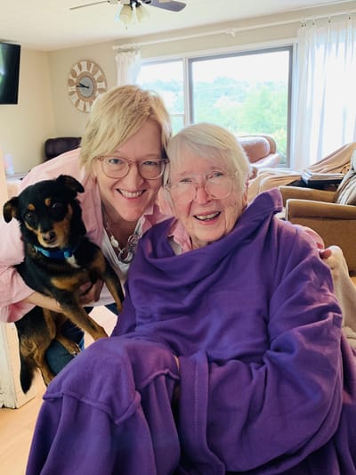 Staff member and resident smiling together