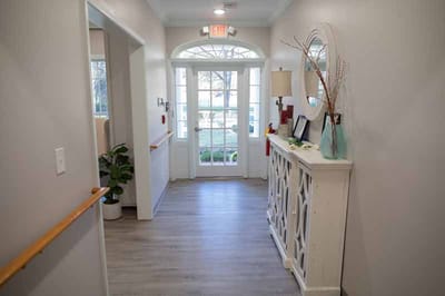 Interior hallway with light decor and plants