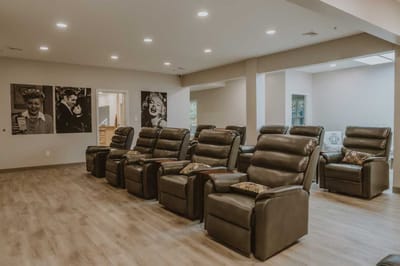 Common area with reclining chairs and artwork