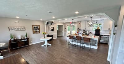 Interior common area with people and kitchen space