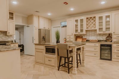Modern kitchen interior with seating.