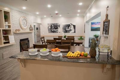Dining area with fruit display and seating