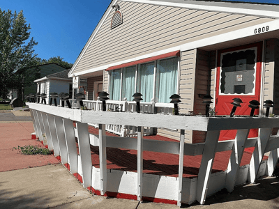 Exterior view of a senior living facility entrance.