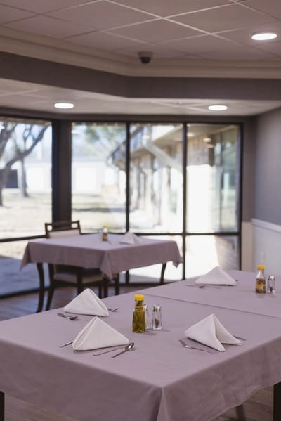 Dining room with tables set for meals