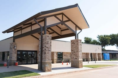 Exterior view of nursing home entrance.
