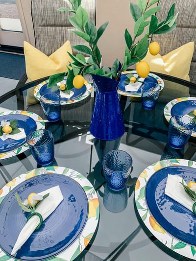 Decorative dining table setting with blue and yellow accents
