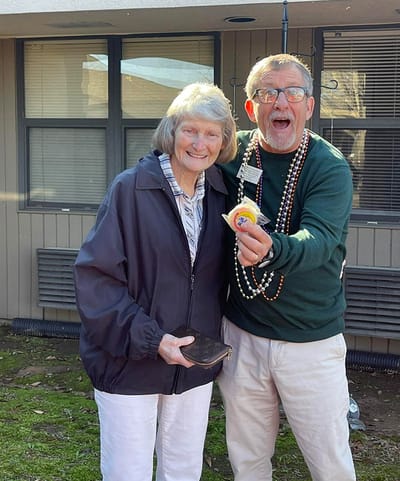 Two residents enjoying a fun moment outdoors.