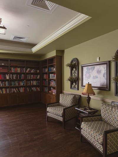 Cozy common area with bookshelves and seating