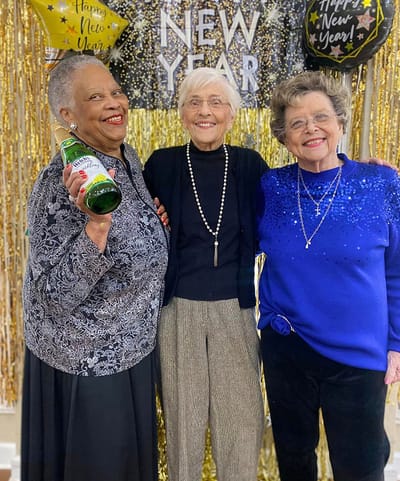 Three residents celebrating New Year together.