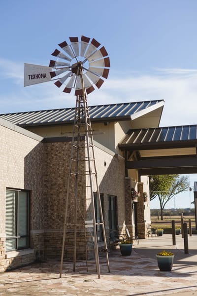 A windmill decoration outside the facility