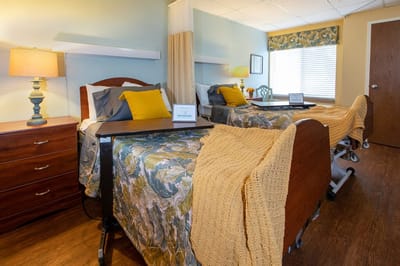 Cozy shared resident room with beds and decor