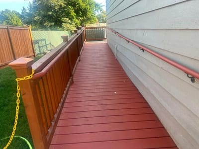 Outdoor ramp leading to a facility entrance.