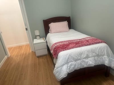 Cozy bedroom with bed and nightstand