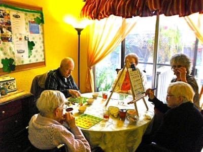 Residents participating in a bingo game activity