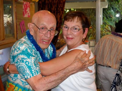 Residents celebrating with friendly embraces