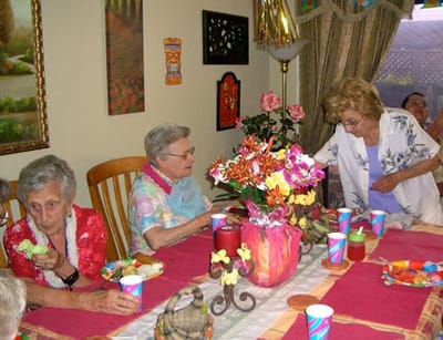 Residents enjoying a meal together at a table.