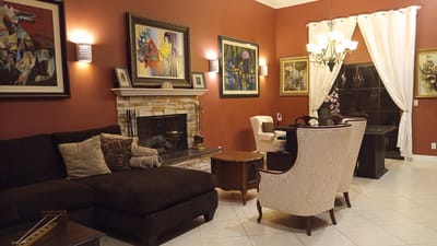Cozy lounge area with comfortable seating and artwork.