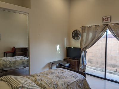 Private resident room with a bed and TV