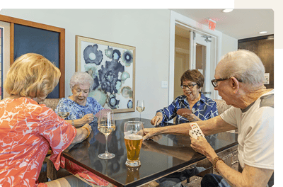 Residents enjoying a card game together.