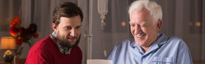 Engaged conversation between a caregiver and a senior.