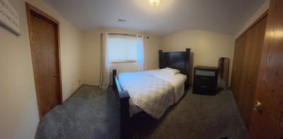 Cozy bedroom with a bed and furniture