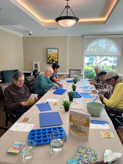 Residents engaged in a gardening activity.