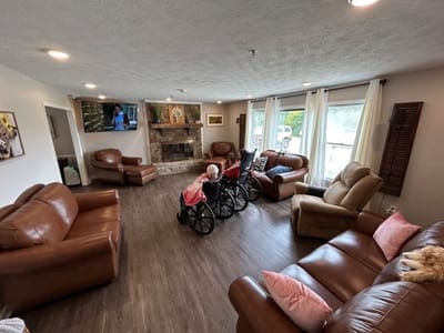 Residents in a cozy common area with seating