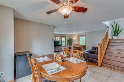 Bright common area with dining table and living room