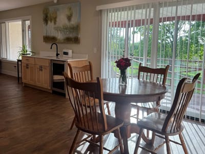 Bright common area with a dining table and view of the outdoors