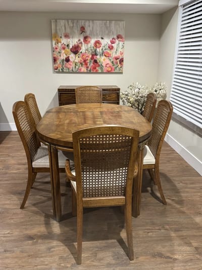 Interior common area with a dining table and floral artwork