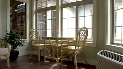 Cozy seating area with a table and chairs by a large window