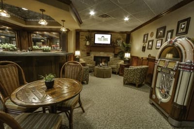 Cozy common area with comfortable seating and a jukebox
