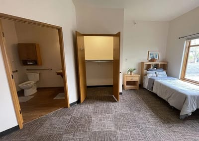 Private resident room with bed and bathroom