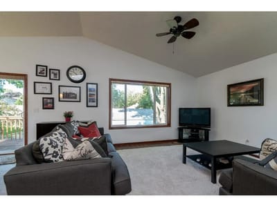 Bright common area with seating and large windows