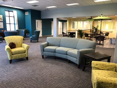 Bright common area with seating and decor
