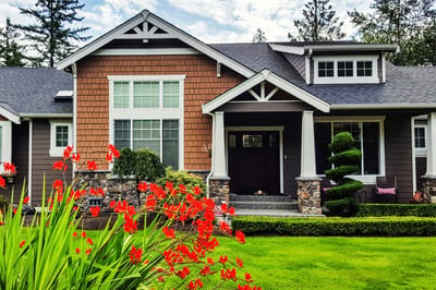 Exterior view of a residential building with flowers