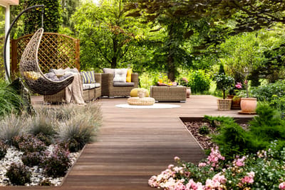 A serene outdoor seating area surrounded by greenery