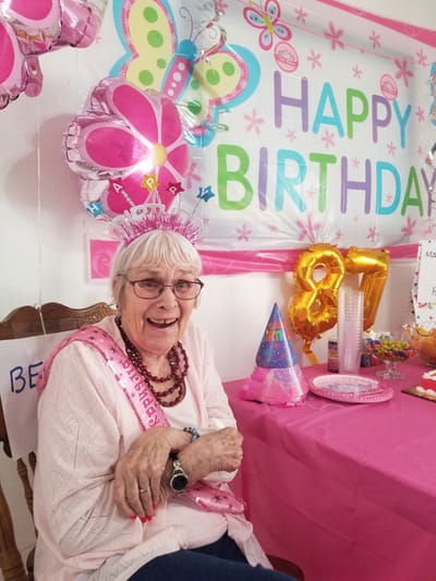 Resident celebrating a birthday with decorations
