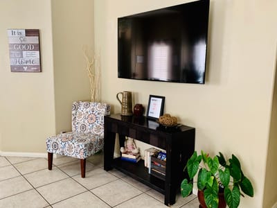 Cozy interior common area with decor and a TV