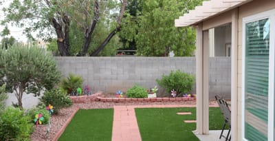 Well-maintained garden area with colorful decorations