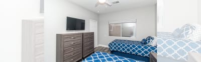 Neatly furnished twin bedroom in assisted living facility