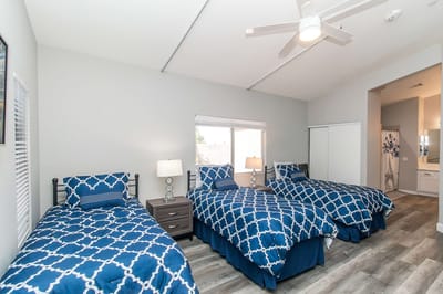 Brightly decorated private resident room with two beds