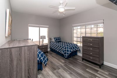Private resident room with two beds and modern decor