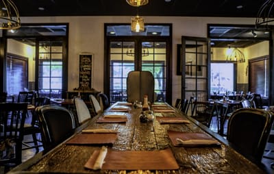 Interior view of a dining room with tables and chairs