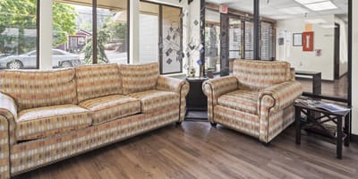 Common area with couches and furniture in vibrant colors