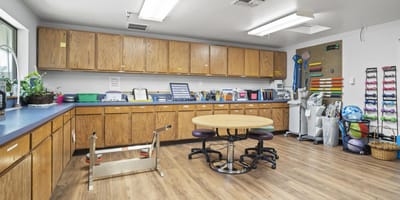 Activity room with rehabilitation equipment and circular table