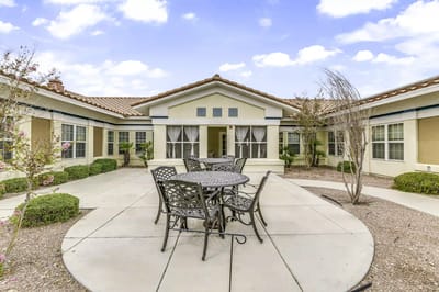 Outdoor patio area with seating and landscaping